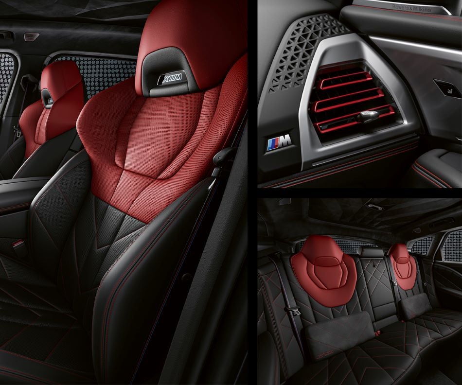 Detail of front seats, clad in exclusive BMW Individual Fiona Red & Black Merino Leather with exclusive M Signature Trim and red stitching and accents. Detail of red accented vent. Detail of rear M Lounge with exclusive XM pillows in Tom Bush BMW Orange Park | Jacksonville FL
