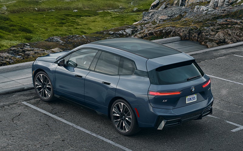 The BMW iX parked in a parking spot. | Tom Bush BMW Orange Park in Jacksonville FL